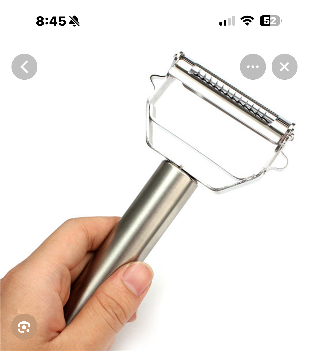 Hand holding the peeler