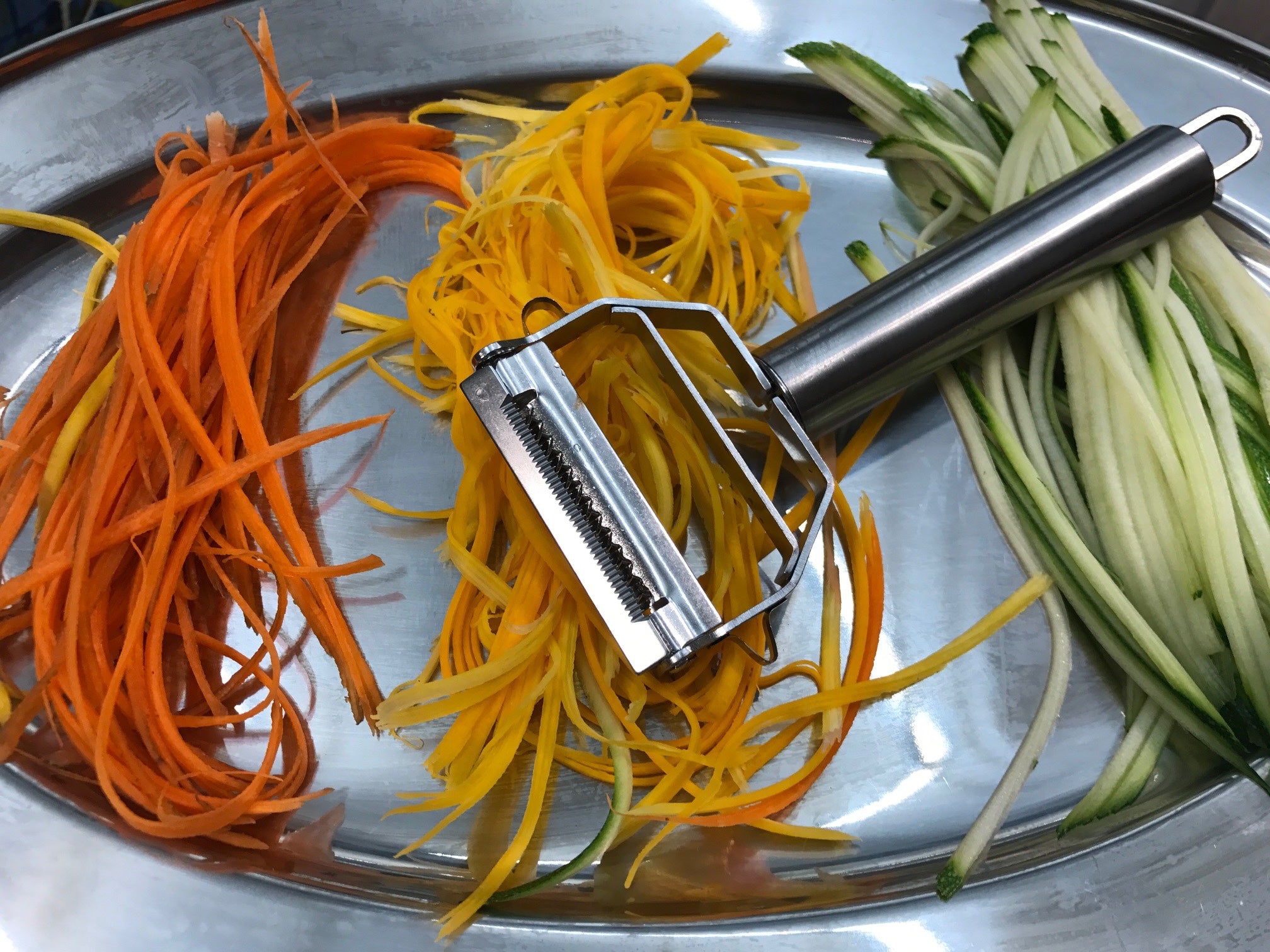 Chef's Envy Spiralizer with colorful vegetable noodles